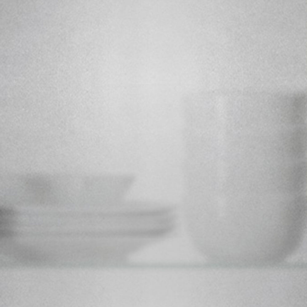 Elegant glass cabinet doors showcasing Zen Livings modern kitchen cabinetry in Calgary.