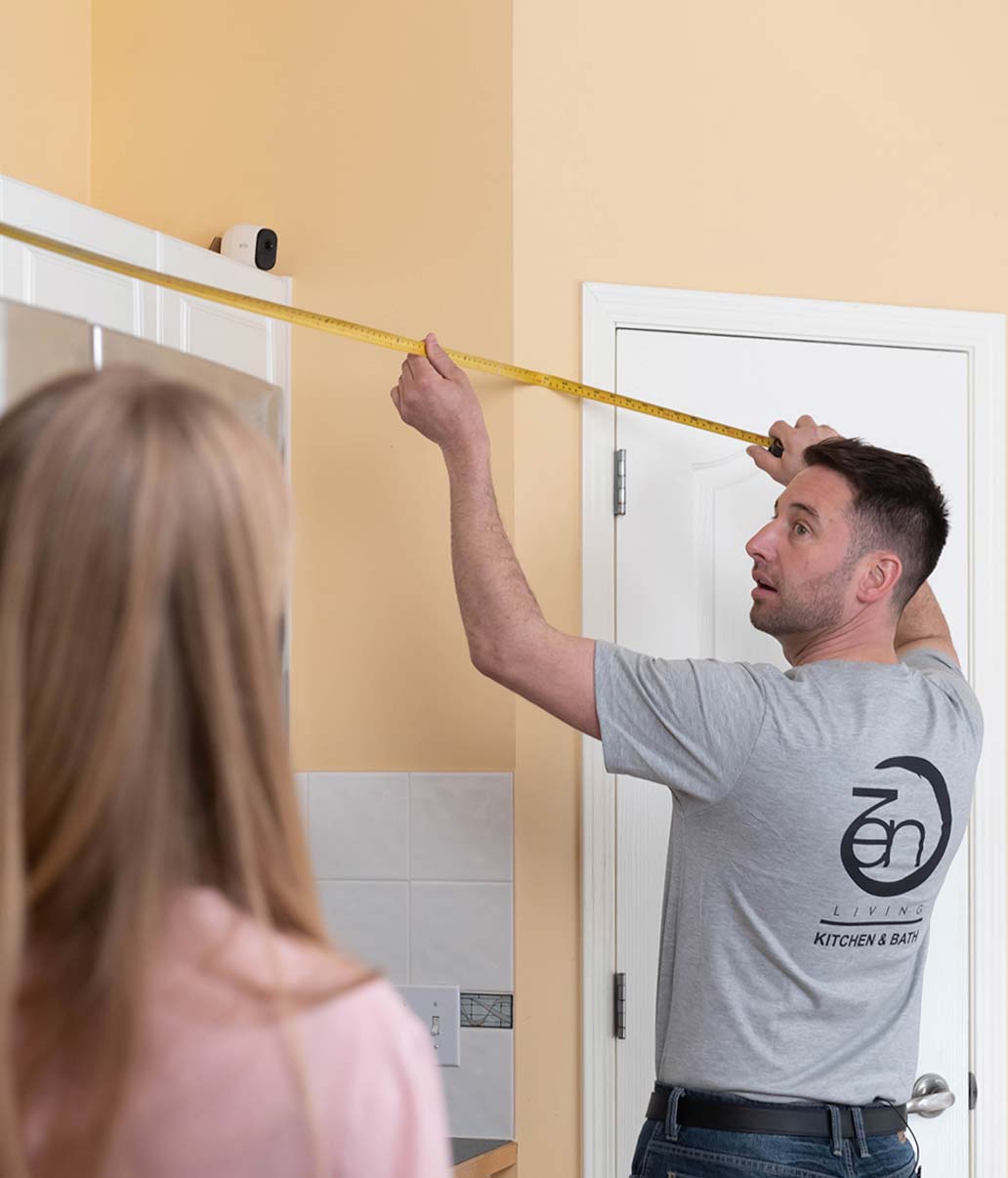 Zen Living team performing final touches on kitchen installation in Calgary, ensuring perfect cabinet and countertop adjus...