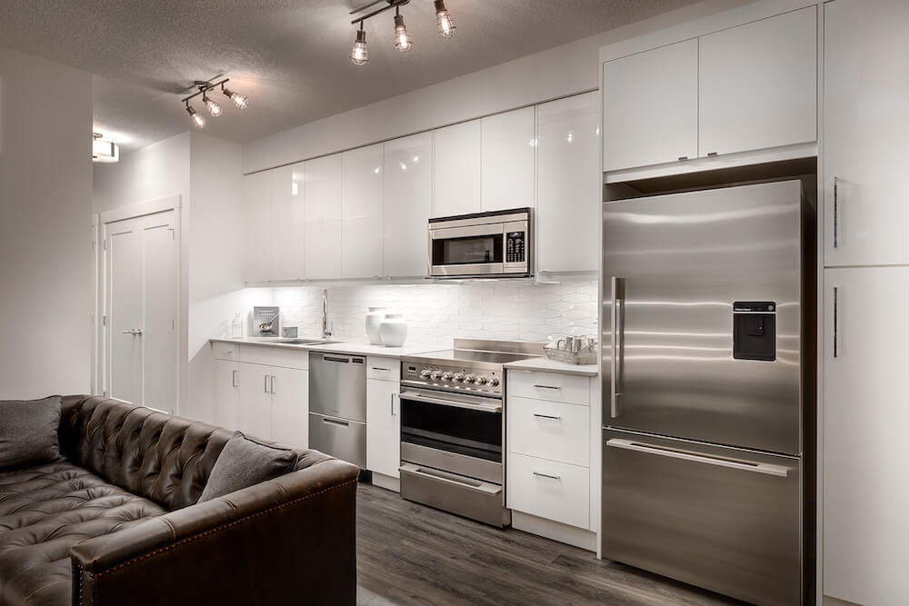 6299b278626c9983e0f79589 high gloss acrylic slab cabinets make a modern home